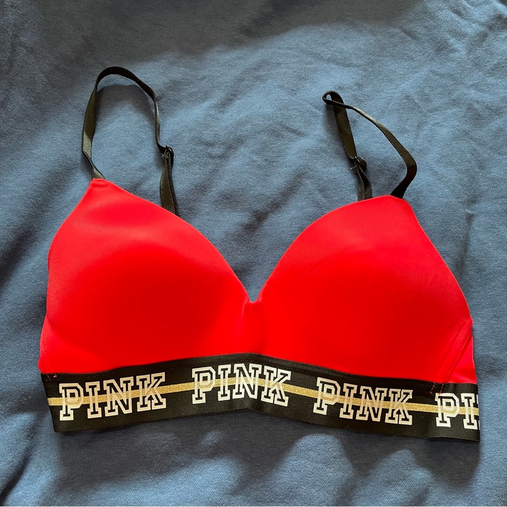 PINK Wear Everywhere Bra Wireless Lightly Lined Metallic Spellout Red 32C